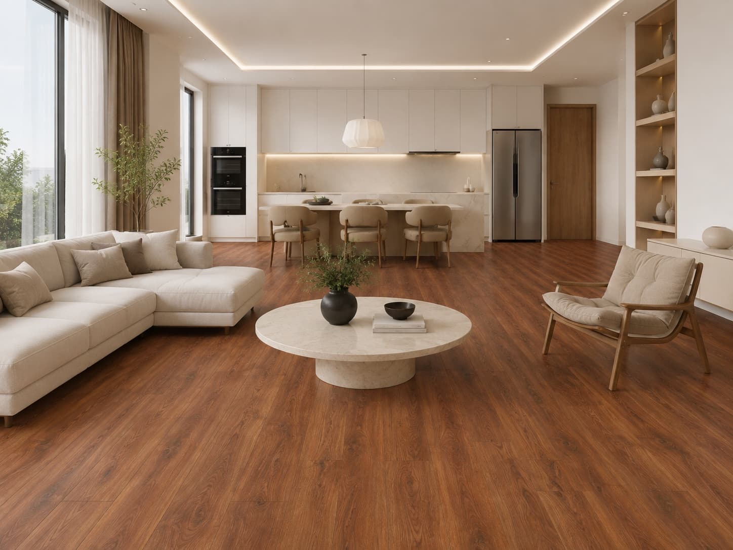 A white kitchen with a marble island flows into a cream lounge — deep cherry planks warm the whole space.